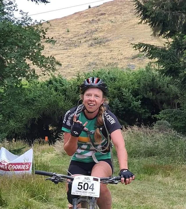 Emma-Jane Lambie, owner of Blooming Fantastic Garden Services, on her mountain bike